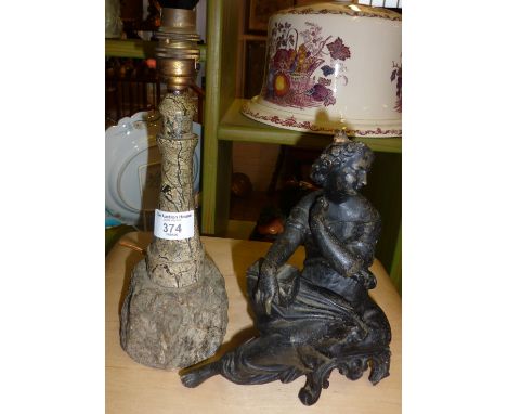 Carved serpentine lighthouse table lamp, and another Victorian figural spelter lamp base