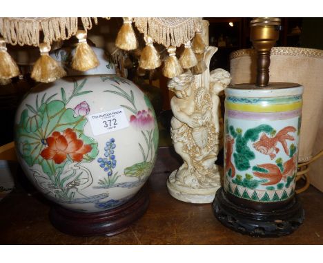 Chinese porcelain table lamp bases, one decorated with fish, the other water lilies and cranes, and another lamp