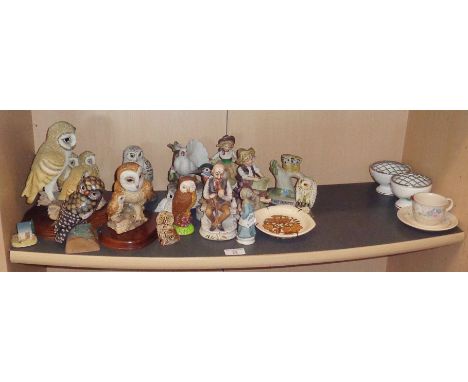 Shelf of assorted owl and other ornaments