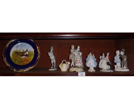 Three Continental porcelain figurines and other ceramics (shelf of)