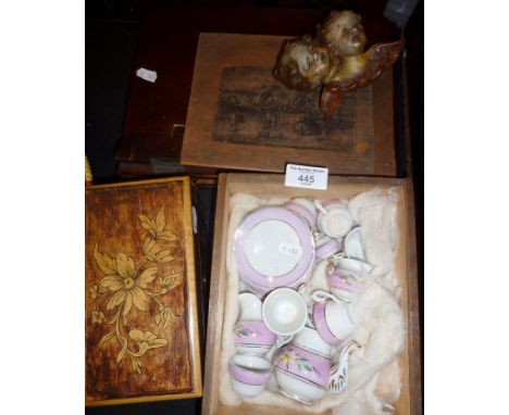 Victorian doll's china teaset, a penwork stained wood tea caddy and a piano sheet music stand