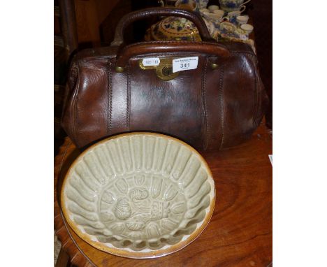 Vintage leather doctor's Gladstone bag, and a stoneware jelly mould with Prince of Wales feather design