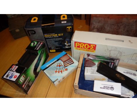A 'Pro' router kit and bits, a Parkside multi-purpose tool, a Drafting machine and other tools, etc.