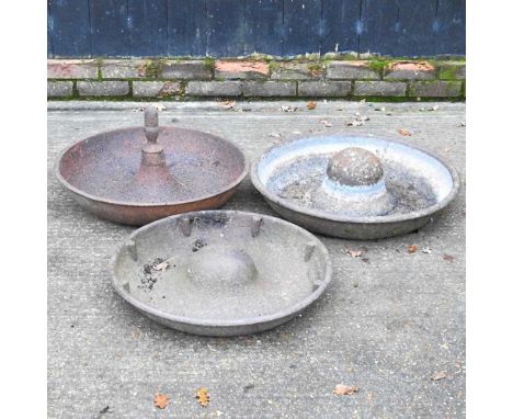 A cast iron pig trough, 65cm diameter, together with two others similar (3)