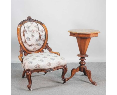 A Victorian walnut trumpet shaped games/work table, together with a Victorian cream upholstered button back chair (2)