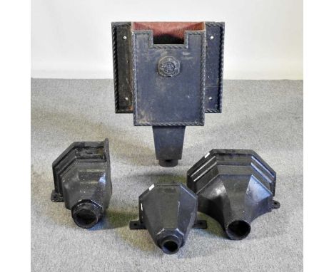 A black painted iron hopper, 58cm high, together with three others smaller (4)  