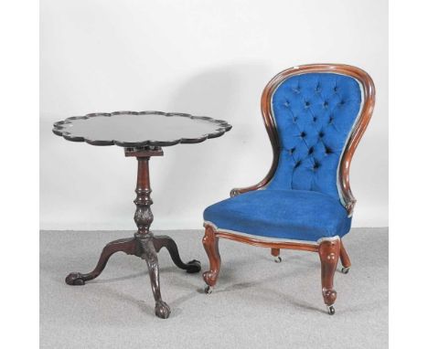 An early 20th century mahogany supper table, of George II design, on a tripod base, together with a Victorian blue upholstere