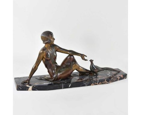 A large Art Deco patinated bronze figure of a young lady, seated with a pheasant, on a veined marble base, 65cm wideOverall c