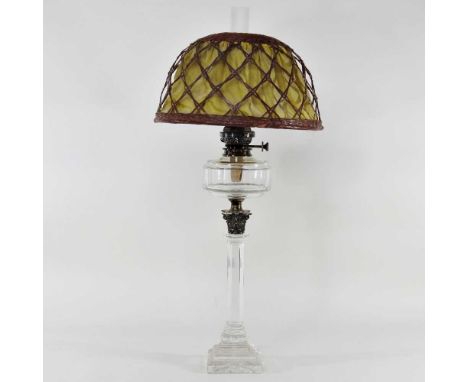 A 19th century crystal oil lamp, in the form of a Corinthian column, with a silver plated capital, 77cm highOverall condition