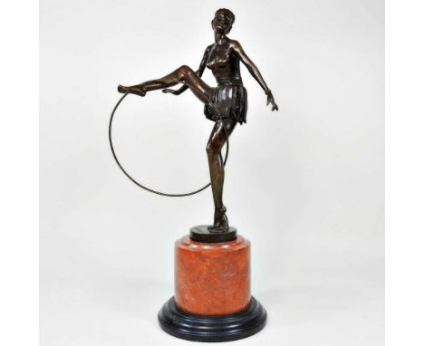 After D Alonzo, a modern bronze Art Deco figure of a lady, with hoop, on a marble base, 48cm high