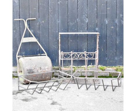 An iron garden roller, together with a pair of hay racks and a metal boot scraper (4)