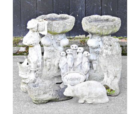 A reconstituted stone bird bath, 54cm high, together with another and various garden ornaments