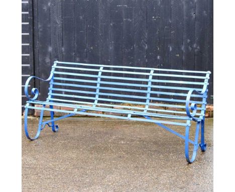 A blue painted iron garden bench, with a strapwork seat, on scrolled end supports183cm wide