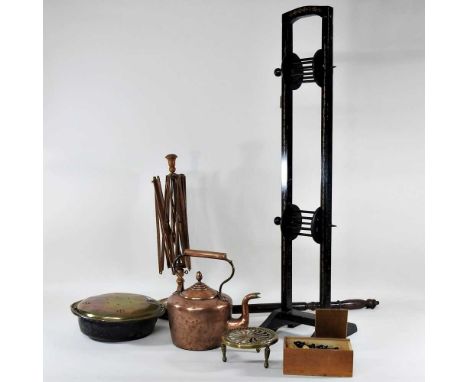 A 19th century wooden wool winder, together with another, a warming pan, games and metalwares, to include a French brass case