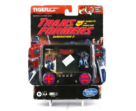Transformers Generation 2 Tiger Electronics Handheld Game Item is boxed and in fair condition, with some minor dents/natural 