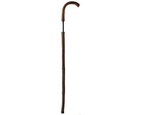 A CUSTOMS OFFICER'S SWORD STICK, bentwood handle and wooden haft revealing a square section tapering blade, metal ferrule, 86