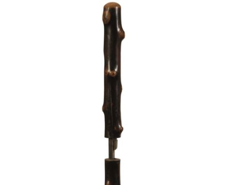 A LATE 19TH CENTURY SWORD STICK, briar haft and handle with button opening mechanism revealing a 43cm fullered tapering blade
