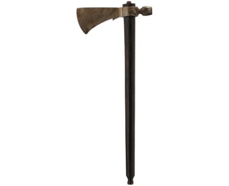 AN EARLY 20TH CENTURY INDIAN TOMAHAWK PIPE, the shaped steel head with integral pipe bowl, mounted on a hollow pipe haft, tog