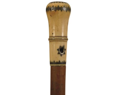 A LATE 18TH/EARLY 19TH CENTURY WALKING STICK, the ivory pommel handle inlaid with pique work decoration and pierced to take a