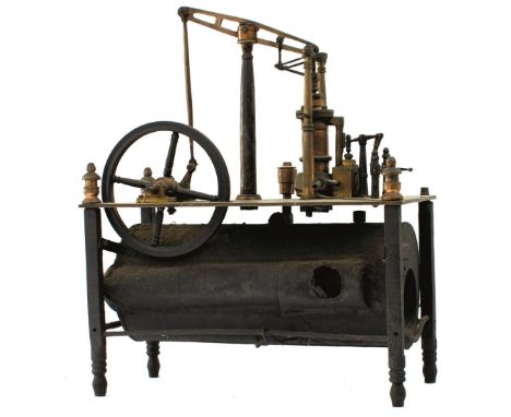 A SCRATCH BUILT MODEL STATIC STEAM ENGINE, the brass base plate set with a Sanderson Beam engine and boiler beneath. Worn.