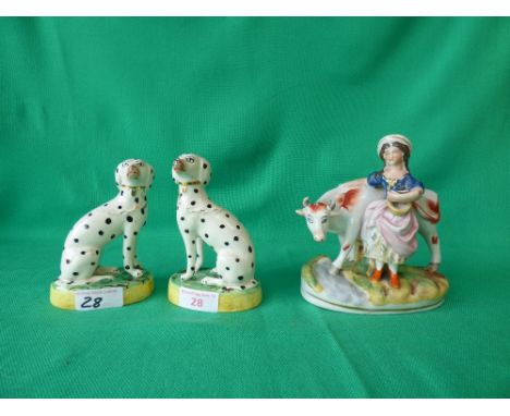 Pair of Staffordshire figures of Dalmatians and one other