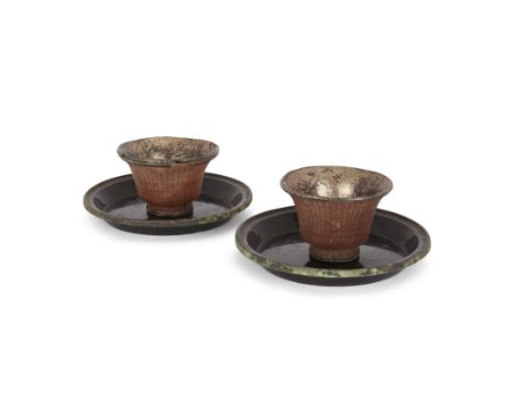 A pair of Chinese lacquer cups and a pair of lacquer saucersQing dynasty, 17th centuryComprising a pair of copper-lined sauce
