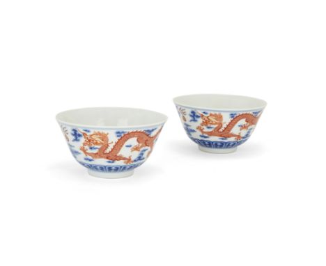 A pair of Chinese underglaze blue and iron-red 'dragon' bowlsEarly 20th century, Jiangxi Ciye Gongsi marksEach typically pain