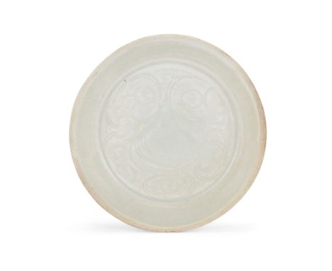 A small Chinese qingbai-glazed carved dishSouthern Song dynastyWith unglazed rim, the centre carved with lotus under the blui