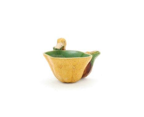 A Chinese famille verte on biscuit 'duck and lotus' water dropperQing dynasty, Kangxi periodThe bowl formed as a lotus leaf w