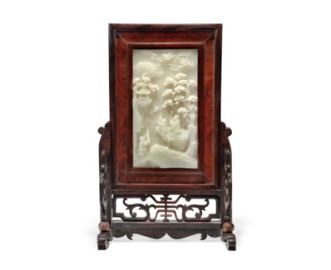 A Chinese pale green jade table screenQing dynasty, 18th/19th centuryFinely carved in high relief with Shoulao and two attend