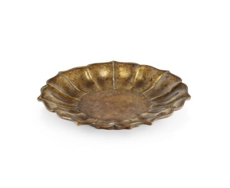 A Chinese bronze lobed dish 17th century, apocryphal Xuande mark Elegantly raised on a short foliate foot rising to shallow s