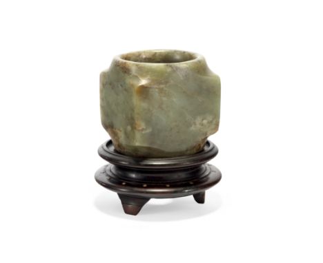 A Chinese celadon jade cong19th centuryThe cong is a short cylinder enclosed by four square corners, with straight walls insi