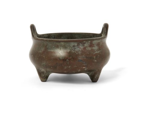 A Chinese bronze tripod incense burnerQing dynasty, 18th/19th century, apocryphal Xuande markCast with two loop handles to th