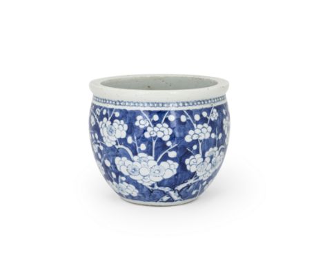 A Chinese blue and white 'prunus' jardiniereQing dynasty, mid-19th centuryDecorated with prunus blossom on a 'cracked ice' gr