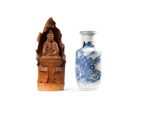 A Chinese blue and white rouleau vase and a Chinese bamboo figure of GuanyinLate Qing dynastyThe vase with apocryphal Kangxi 