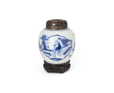 A Chinese blue and white jar Qing dynasty, Kangxi periodThe body set with a lobed panel painted with a deer in a mountainous 