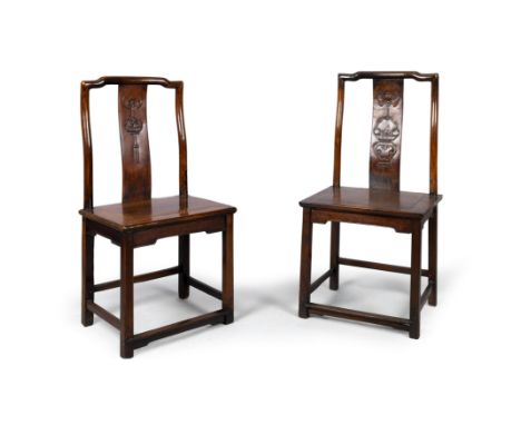 A pair of Chinese hongmu chairsQing dynasty, 19th century With shaped rectangular backs, the slightly curved back splats carv