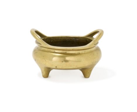 A Chinese polished bronze tripod incense burnerLate Qing dynasty, apocryphal Xuande markCast with two loop handles to the rim