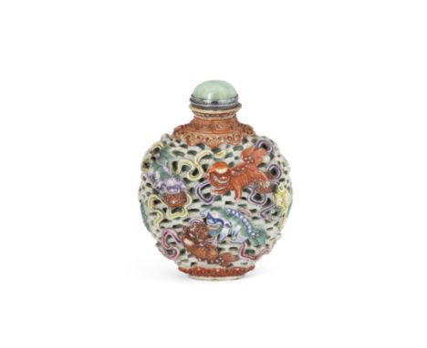 A Chinese moulded reticulated 'Buddhist Lions' snuff bottleLate Qing dynasty, apocryphal Jiaqing markMoulded and pierced with