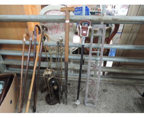 A selection of tools etc including fire irons and walking sticks