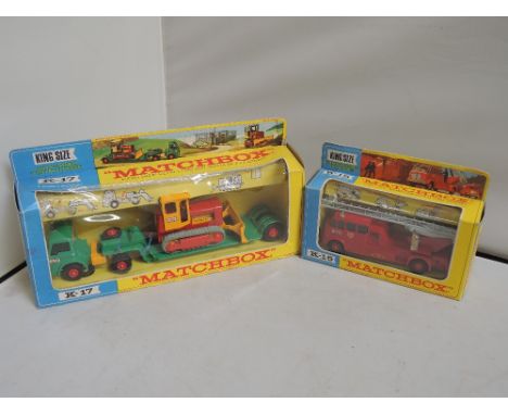 Two Matchbox Kingsize die-casts, Low loader with bulldozer and Merryweather fire engine, both in original window boxes K17 an