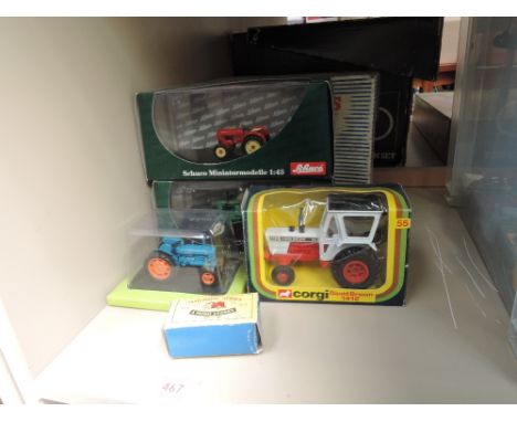 A Dinky die-cast Elevator Loader 564 boxed, A Corgi die-cast David Brown Tractor 1412 in window box 55, and a Matchbox Tracto