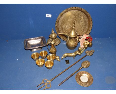 Various Brass ornaments including Far Eastern coffee set with jugs, cups and tray, dog, toasting fork, fire poker and cow bel