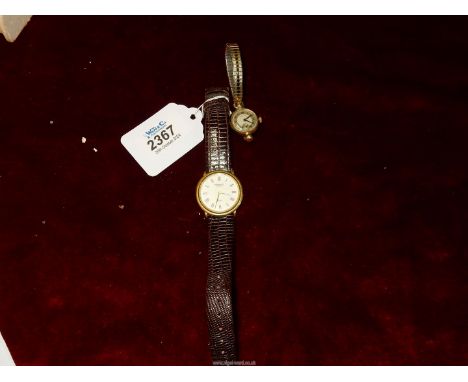 A gold backed ladies Rotary Watch with expanding bracelet and a Raymond Weil 18ct gold plated watch with leather strap.