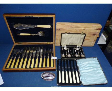 Three cased sets of plated cutlery to include: fish eaters and server's, butter knives and teaspoons, a set of kitchen knives