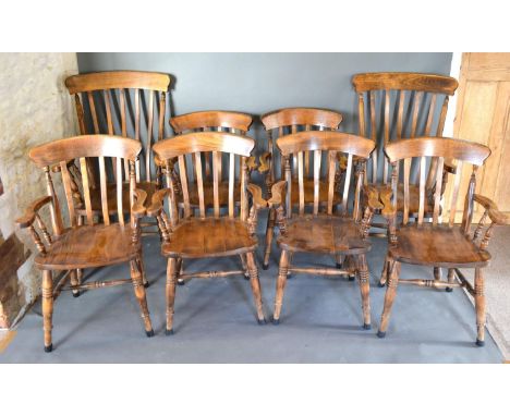 A Set of Six Armchairs with Stick Backs above Panel Seats raised upon turned tapering legs with stretchers together with a si