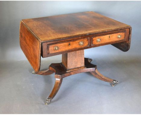 A Regency Rosewood Brass Inlaid Sofa Table, the two frieze drawers opposed by dummy drawers with circular brass handles raise