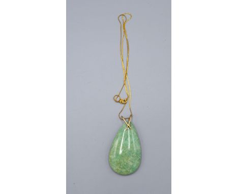 A Green Jade Pendant with 18ct. Gold Fine Chain 