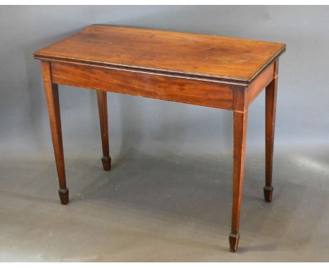 A 19th Century Mahogany Card Table, the hinged top above an end drawer raised upon square tapering legs with spade feet 