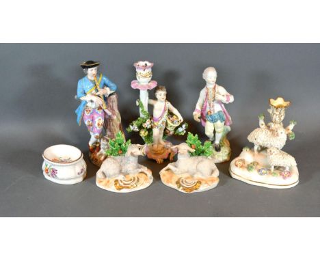 A 19th Century Porcelain Candlestick of figural form, gold anchor mark, 18 cms tall, together with various other figures and 